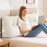IASEAHK Queen headboard pillow in use for upright reading and work.