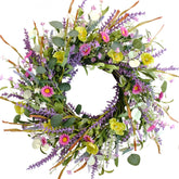 Idyllic daisy front door wreath with bright blooms for curb appeal and seasonal charm.