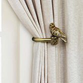 ILAISIHOME bird-design curtain holdback in gold secures drapes while adding charm.