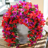 INSPRING faux bougainvillea trailing vine adds sun‑resistant color to outdoor décor.
