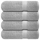 Infinitee Xclusives bath towels four-piece collection in a luxurious bathroom
