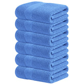 Infinitee Xclusives blue hand towels six-piece set in bathroom for spa-like softness.