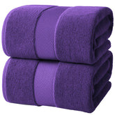 Infinitee Xclusives jumbo bath sheets folded neatly, highlighting generous coverage and hotel-quality softness