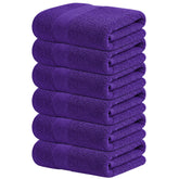 Infinitee Xclusives Purple Hand Towels folded on a shelf show plush softness