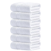 Infinitee Xclusives white hand towels, 16x28 inches, hotel-quality softness.