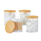 INIUNIK glass Qtip holder with lids on for sleek bathroom organization.