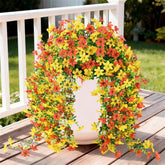 INQCMY artificial daisy flowers with eucalyptus for outdoor use, maintenance-free decor.