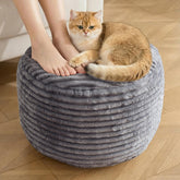 INSPIRE CRAFTER round pouf ottoman in dark grey corduroy serves as a stylish footrest