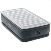 Intex twin-size air mattress with 18-inch height and built-in pump for quick setup.