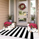 iohouze black white striped rug on the front door with a durable cotton blend.