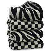 Jacquotha bathroom towels in a checkered black pattern, soft and absorbent for daily use.