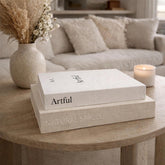 Jas & Jax Goods decorative books stacked on a coffee table for a modern living room