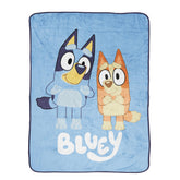 Jay Franco Bluey throw blanket with overall design enhances cozy living room decor.