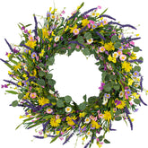 J'FLORU large spring wreath on front door with daisies and lavender, enhancing curb appeal.