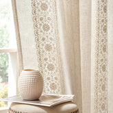 Jinchan Weslie curtains with ivory floral embroidery add vintage charm to the living room.