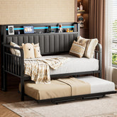 Jocoevol daybed with trundle and LED light shows the pop-up wheel mechanism.