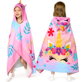 Joiedomi Unicorn Hooded Towel at the beach scene, absorbs water quickly for active kids.