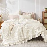 JOLLYVOGUE Ivory Queen comforter set with seersucker texture and ruffle trim.