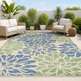 Jonathan Y floral textured weave rug with navy-green zinnia pattern for outdoor spaces.