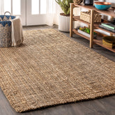 Jonathan Y Pata hand woven rug in natural jute enhances living room ambience