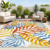 Jonathan Y Tropics Palm Leaves rug closeup highlighting vibrant palm fronds for outdoor spaces.