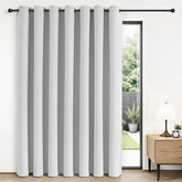 Joydeco blackout sliding door curtains in grayish white block sunlight and glare.
