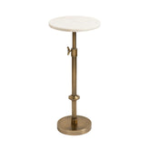 Kate and Laurel Engles marble top pedestal table beside sofa, offering a refined surface.