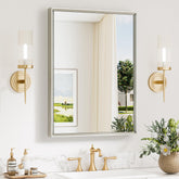 Keonjinn brushed nickel mirror over sink with beveled edge for daily grooming.