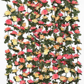 Khoyime champagne rose garland draped on an outdoor arch for a romantic wedding backdrop.
