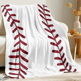 King DARE baseball blanket folded on sofa for cozy lounging.