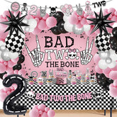 Klarvyius Bad Two the Bone backdrop with skeleton motifs for a bold 2nd birthday party.