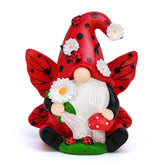 KnomeKo Ladybug Gnome with daisies brightens outdoor spaces.