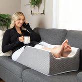 Kölbs Double Leg Elevation Pillow with groove keeps legs aligned for gentle support.