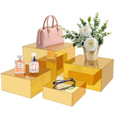 Koretech gold acrylic mirrored risers 5-inch β elevate jewelry displays with luxe reflection.