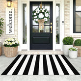 KOZYFLY black and white striped area rug enhances entryway curb appeal