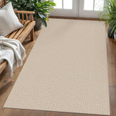 KOZYFLY ivory and khaki braided rug in a living room provides soft, neutral backdrop.