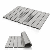 Krave Living foldable stone bath mat laid flat for quick moisture absorption.