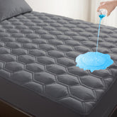 KUTUU king waterproof mattress pad top view showing soft, breathable fabric for cooler sleep.