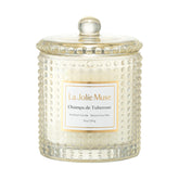 LA JOLIE MUSE Champs de Tuberose candle in hobnail glass jar glowing warmly for evenings