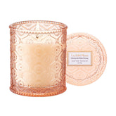 LA JOLIE MUSE Citrine and Pink Peony candle bottle emits bright citrus and lifts mood.