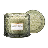 LA JOLIE MUSE Eucalyptus & Alpine Sage candle jar with embossed daisy motif, ready to elevate decor and scent.