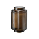 LA JOLIE MUSE Santal Himalayen candle in a fluted jar enhances elegant ambiance.