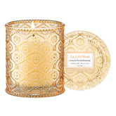 LA JOLIE MUSE Yuzu & Neroli Blossom Candle in decorative glass jar enhances home decor.
