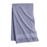 Lacoste Heritage towel border detail highlighting Supima softness and color retention.