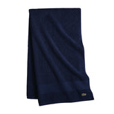 Lacoste Heritage towel navy close-up texture for plush softness and absorbency.