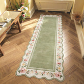 Lahome Floral 2x6 green scalloped runner with non-slip backing on wood floor.