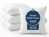 Lane Linen 4-pack 18x18 white pillow inserts add plush volume to a sofa.