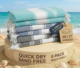 Lane Linen oversized pool towels laid flat in tropical colors for beach days.