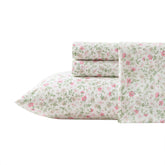 Laura Ashley Queen Sheet Set Bonnie Pink on bed for timeless comfort and style.