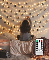 LECLSTAR 50-LED photo clips on a clear strand showcase memories with warm illumination.